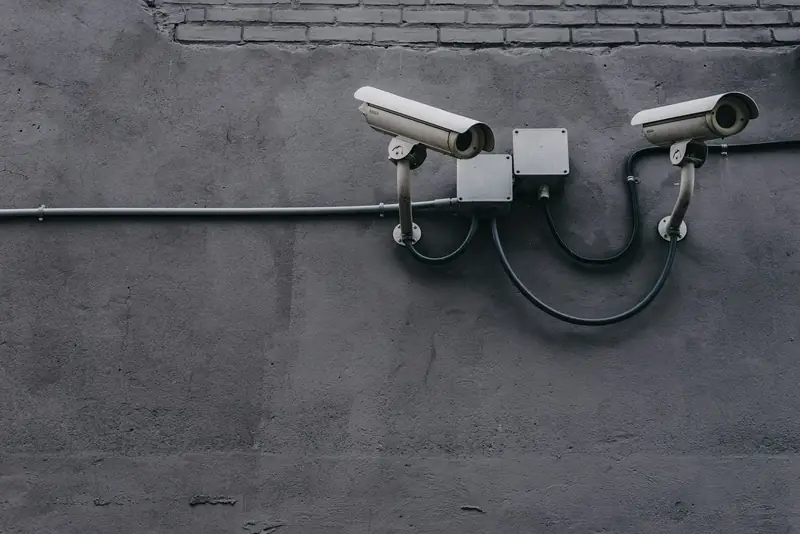Two bullet CCTV cameras mounted on a wall