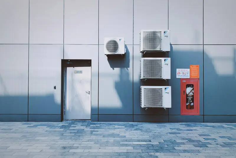 Air conditioning outdoor units mounted on a commercial building wall